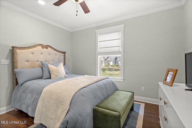 bedroom featuring ceiling fan, baseboards, dark wood-style floors, and ornamental molding