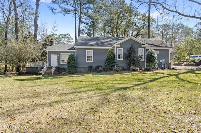 ranch-style house with a chimney and a front lawn