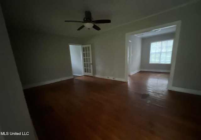 empty room featuring hardwood / wood-style floors and ceiling fan