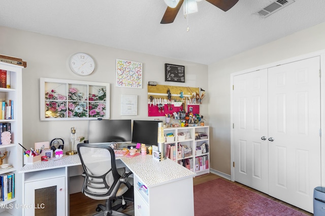 office space with ceiling fan, wood-type flooring, and a textured ceiling