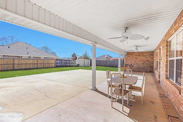 view of patio / terrace featuring ceiling fan and a storage unit