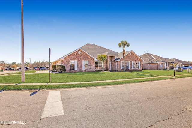 ranch-style home with a front lawn