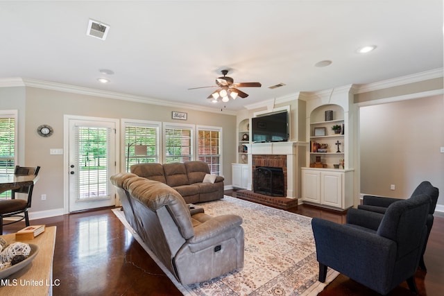 7247 Eastern Rd, Olive Branch, MS 38654 - living room featuring a ceiling fan, crown molding, a brick fireplace, and recessed lighting