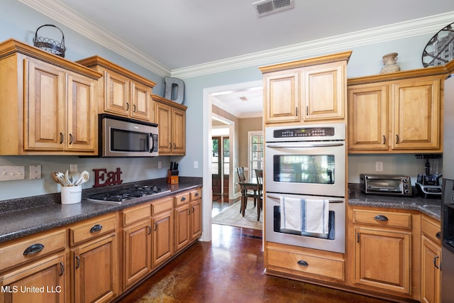 7247 Eastern Rd, Olive Branch, MS 38654 - kitchen featuring stainless steel appliances, ornamental molding, dark countertops, and concrete floors