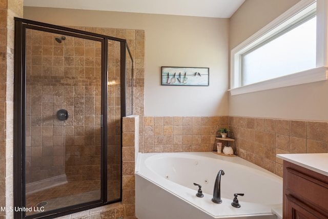 7247 Eastern Rd, Olive Branch, MS 38654 - bathroom with a jetted tub, a shower stall, and vanity