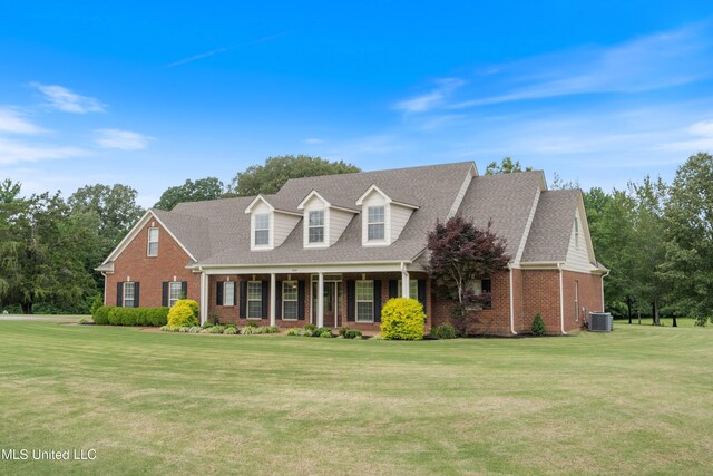 7247 Eastern Rd, Olive Branch, MS 38654 - new england style home with brick siding, a front lawn, roof with shingles, and a porch
