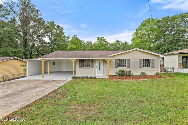 single story home with an attached carport, fence, driveway, and a front lawn