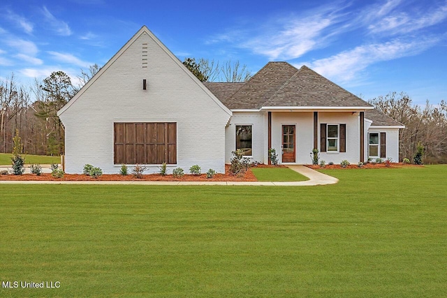 961 Mullican Rd, Florence, MS 39073 - view of front of home featuring a front lawn and roof with shingles