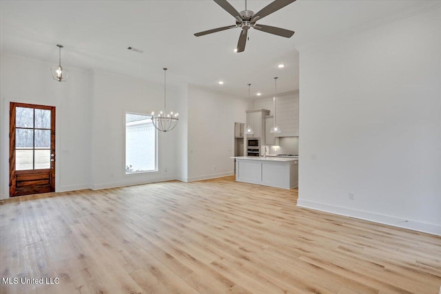961 Mullican Rd, Florence, MS 39073 - unfurnished living room featuring a chandelier, light wood-type flooring, baseboards, and recessed lighting