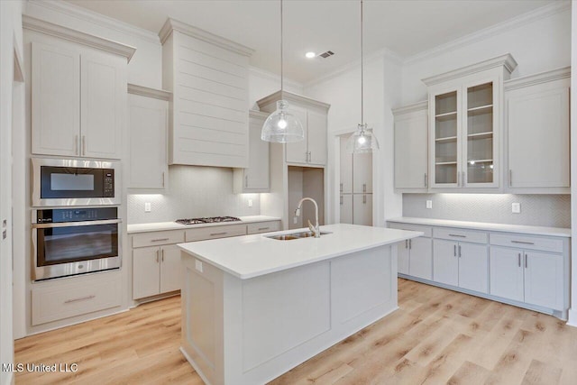 961 Mullican Rd, Florence, MS 39073 - kitchen with stainless steel appliances, a sink, decorative backsplash, light countertops, and crown molding