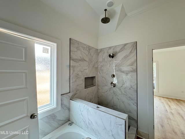 full bathroom with a tub, walk in shower, and wood finished floors