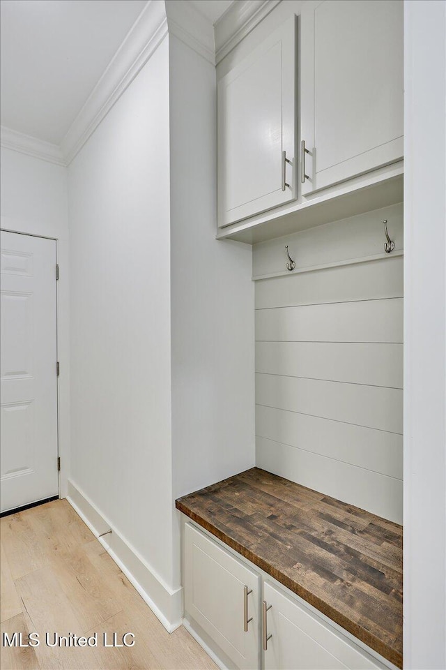961 Mullican Rd, Florence, MS 39073 - mudroom with crown molding, baseboards, and light wood-style flooring
