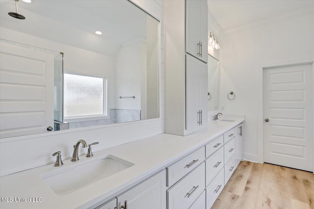 961 Mullican Rd, Florence, MS 39073 - bathroom with double vanity, wood finished floors, ornamental molding, and recessed lighting