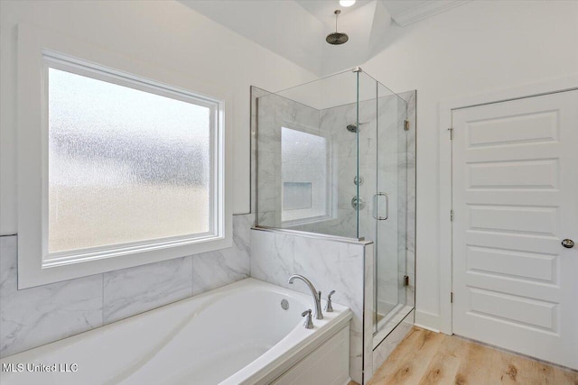 961 Mullican Rd, Florence, MS 39073 - bathroom with a stall shower, a garden tub, and wood finished floors