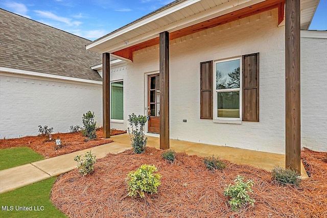 961 Mullican Rd, Florence, MS 39073 - view of home's exterior with a shingled roof and brick siding