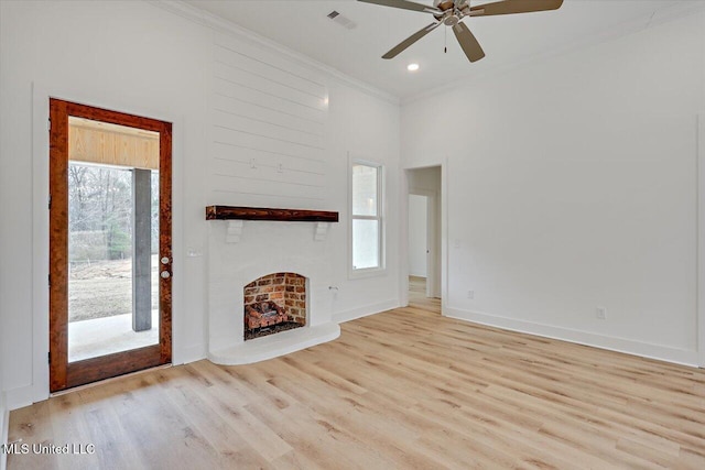 961 Mullican Rd, Florence, MS 39073 - unfurnished living room with ornamental molding, ceiling fan, wood finished floors, a large fireplace, and baseboards