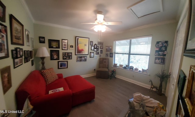 sitting room with ornamental molding, wood-type flooring, and ceiling fan