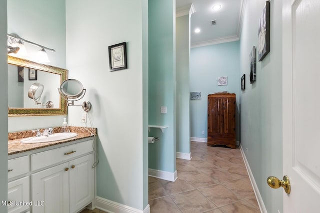 bathroom featuring tile patterned floors, vanity, and crown molding