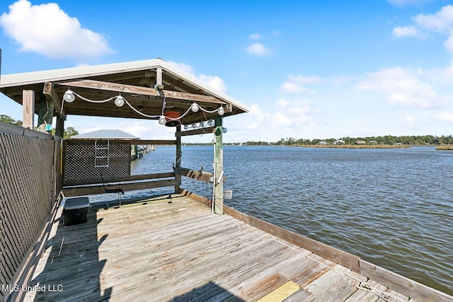 dock area featuring a water view