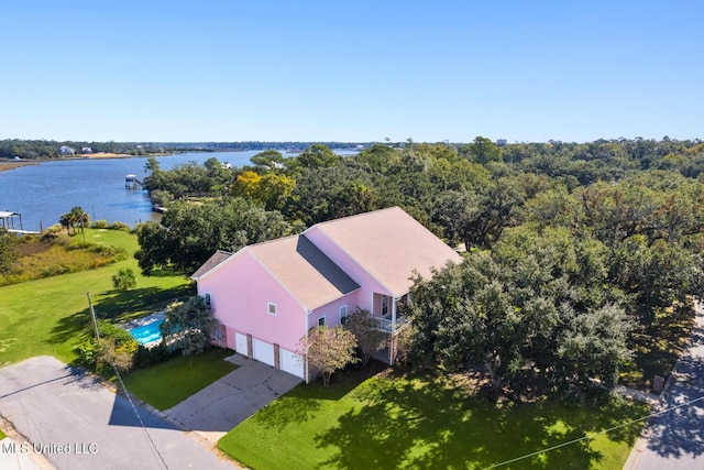 birds eye view of property with a water view