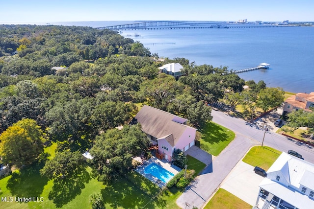 birds eye view of property with a water view