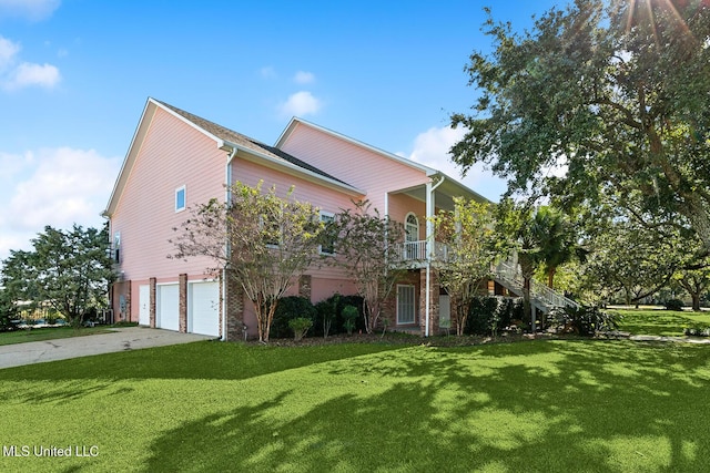 view of front of house with a front lawn and a garage