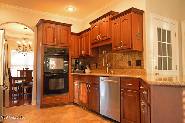 kitchen with a chandelier, stainless steel appliances, tasteful backsplash, crown molding, and light tile patterned flooring