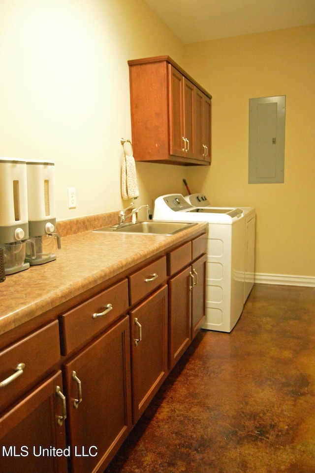 laundry room featuring electric panel, cabinets, sink, and washing machine and clothes dryer