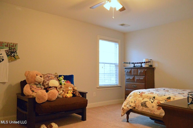 bedroom featuring light carpet and ceiling fan