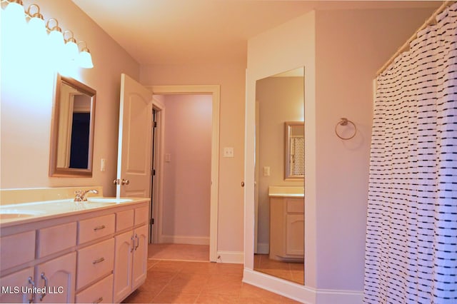 bathroom with vanity, a shower with shower curtain, and tile patterned flooring