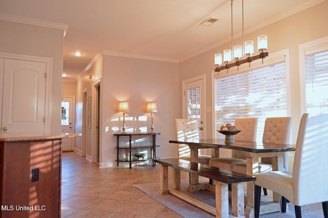 tiled dining room with crown molding