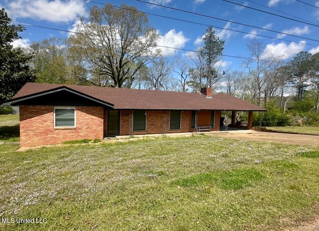 single story home featuring a front lawn and a carport