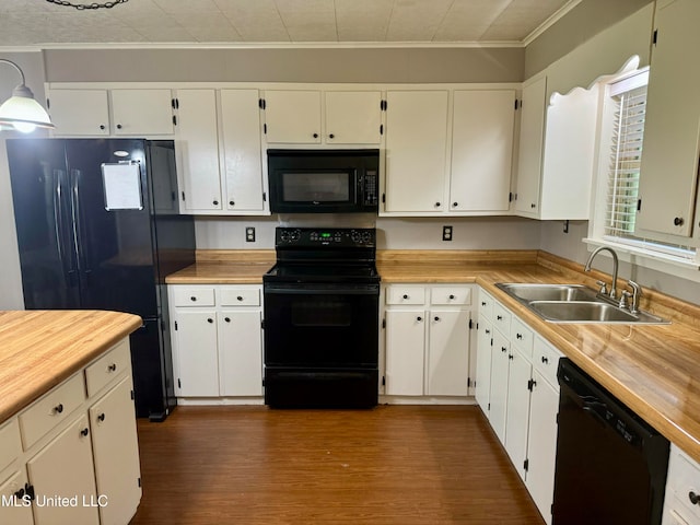 kitchen with sink, black appliances, white cabinetry, and dark hardwood / wood-style floors