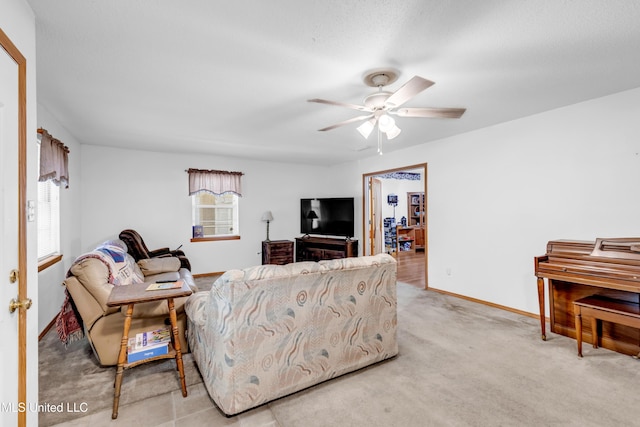 310 John Ave, Pascagoula, MS 39567 - living area with healthy amount of natural light, ceiling fan, baseboards, and carpet