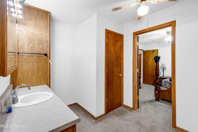 310 John Ave, Pascagoula, MS 39567 - bathroom featuring a ceiling fan, vanity, and baseboards