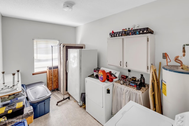 310 John Ave, Pascagoula, MS 39567 - laundry room with water heater, cabinet space, and light flooring