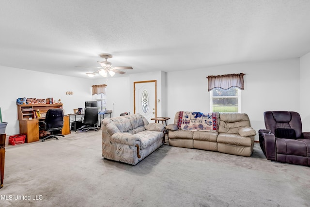 310 John Ave, Pascagoula, MS 39567 - living room with an office area, carpet, a ceiling fan, and a textured ceiling