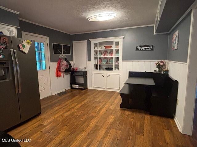 149 Martin Cir, Mendenhall, MS 39114 - dining space featuring a wainscoted wall, a textured ceiling, crown molding, and wood finished floors