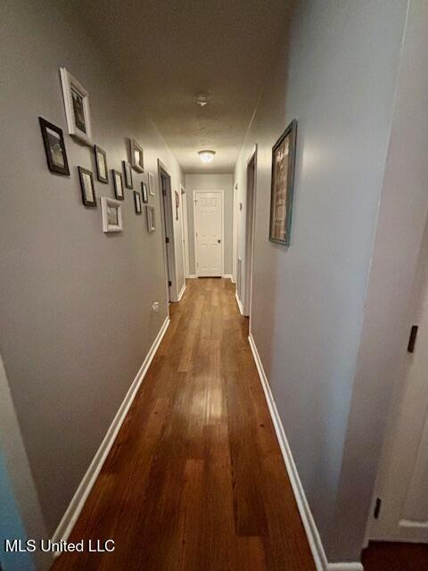 149 Martin Cir, Mendenhall, MS 39114 - hallway with dark wood finished floors and baseboards