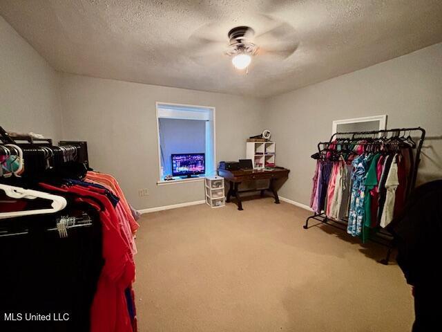 149 Martin Cir, Mendenhall, MS 39114 - walk in closet featuring a ceiling fan and carpet