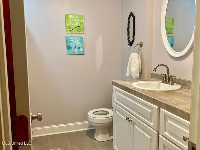 149 Martin Cir, Mendenhall, MS 39114 - bathroom with tile patterned floors, vanity, toilet, and baseboards