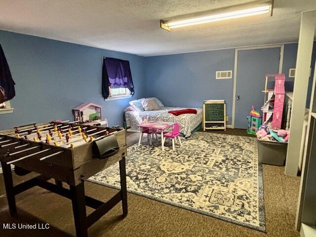 149 Martin Cir, Mendenhall, MS 39114 - bedroom featuring carpet flooring and a textured ceiling