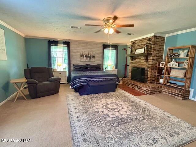 149 Martin Cir, Mendenhall, MS 39114 - carpeted bedroom featuring a brick fireplace, multiple windows, ornamental molding, a textured ceiling, and baseboards