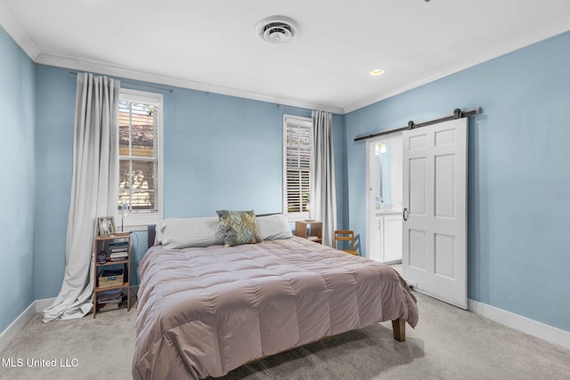 carpeted bedroom with crown molding, ensuite bathroom, and a barn door