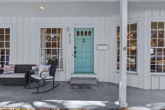 doorway to property with a porch