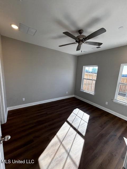 1049 Lexington Lp, Southaven, MS 38671 - unfurnished room with dark wood-type flooring and ceiling fan