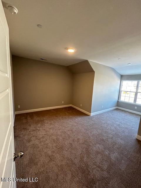 1049 Lexington Lp, Southaven, MS 38671 - bonus room with dark colored carpet