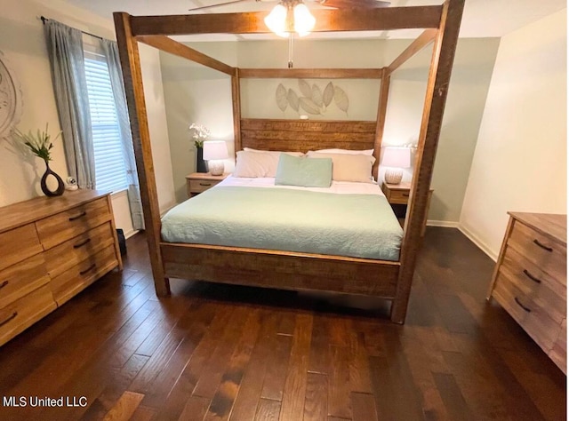 bedroom with dark wood-type flooring and ceiling fan