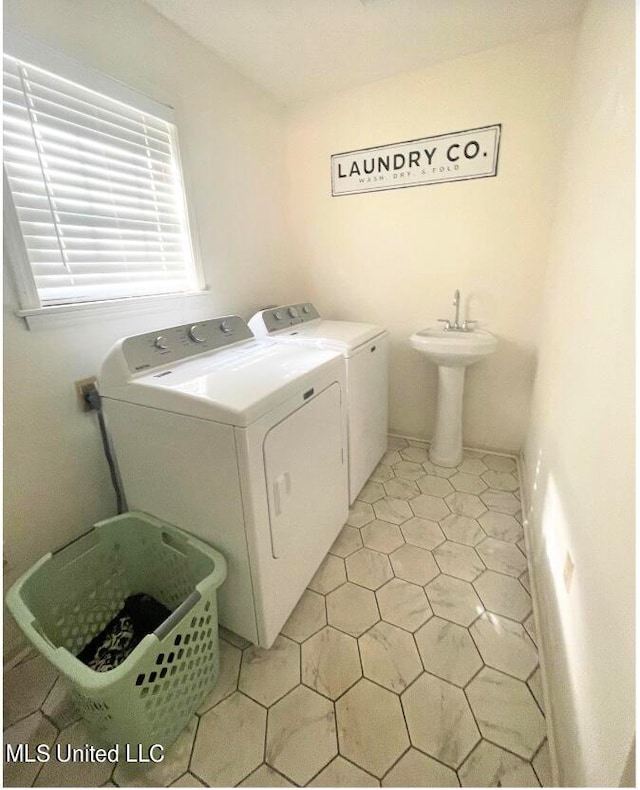 laundry room featuring washing machine and dryer