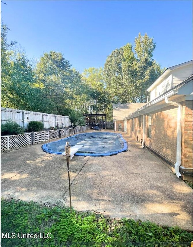 view of swimming pool featuring a patio area